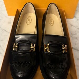 Tod's Black and Gold Leather Loafers with Gold Hardware